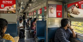 Interior train branding with QR code advertising inside an Indian Railways coach