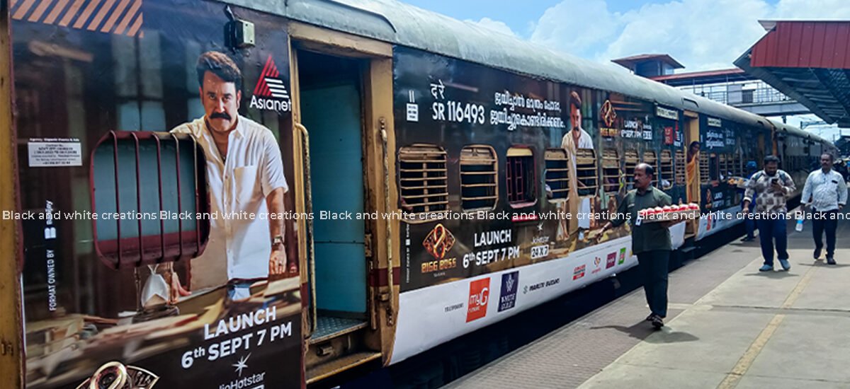 Exterior train branding in India showcasing railway advertising for businesses.