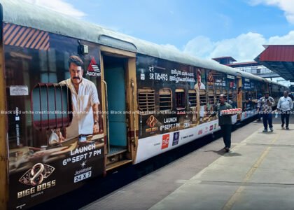 Exterior train branding in India showcasing railway advertising for businesses.